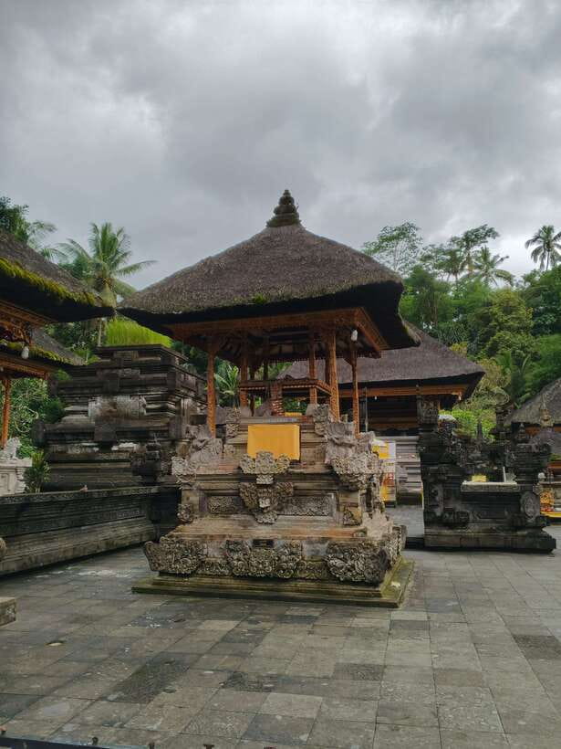 Bali: Rice terrace, Waterfall, and water Temple Day Tour - Kanto Lampo Waterfall and its unusual rock ledges