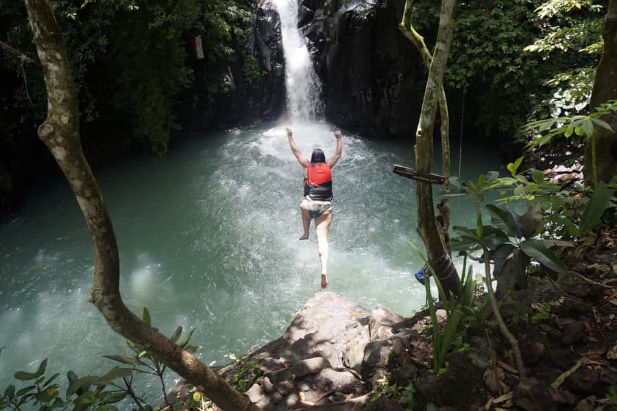 Bali: Sambangan Waterfalls Trekking, Sliding, & Jumping Trip - Twin Waterfalls and the 10-meter jump