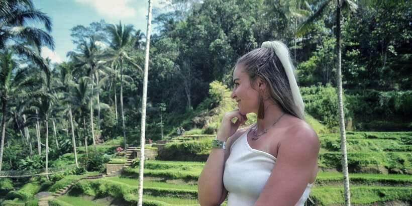Bali: Ubud Waterfall, Village and Pool Club Day Trip - Tegenungan Waterfall, stairs and cool water