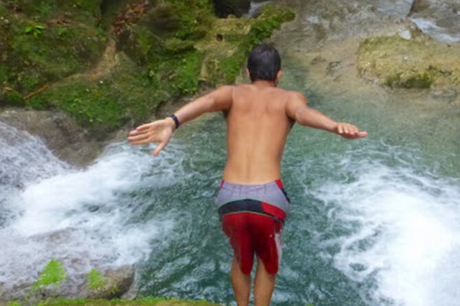 Dunn's River Falls, Blue Hole, Bamboo Rafting, Horseback Combo - Swimming and swinging at the Blue Hole