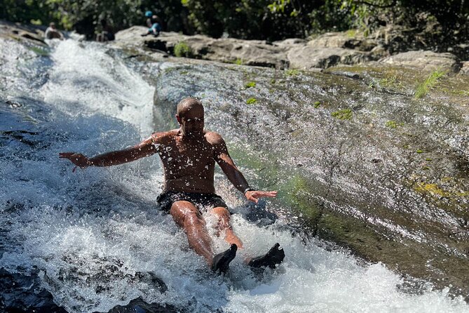 El Yunque Waterslide and Waterfall Tour with Food and Photos - Sliding, swimming, and waterfall time