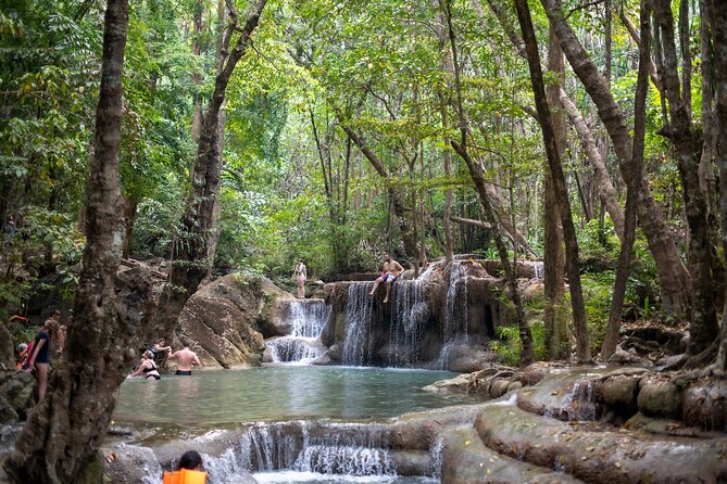 Erawan Waterfalls and Bridge Over River Kwai Tour from Bangkok - Hiking the seven levels at Erawan Waterfalls