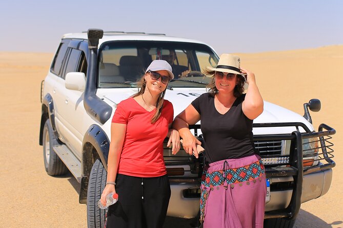 From Cairo 4x4 Safari, Camel Ride, Magic Lake, Waterfalls & Lunch - Dune bashing and sandboarding on soft yellow sand