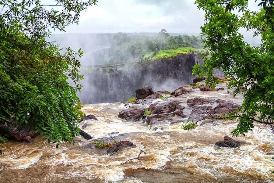 From Livingstone: Victoria Falls Guided Half-Day Tour - Entering Mosi-oa-Tunya National Park