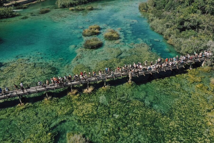 From Split: Krka Waterfalls Tour with Boat Cruise & Swimming - The panoramic boat ride toward Skradin