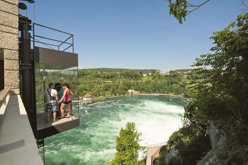 From Zurich: Rhine Falls Coach Tour with Entry Tickets - The optional boat ride near the spray