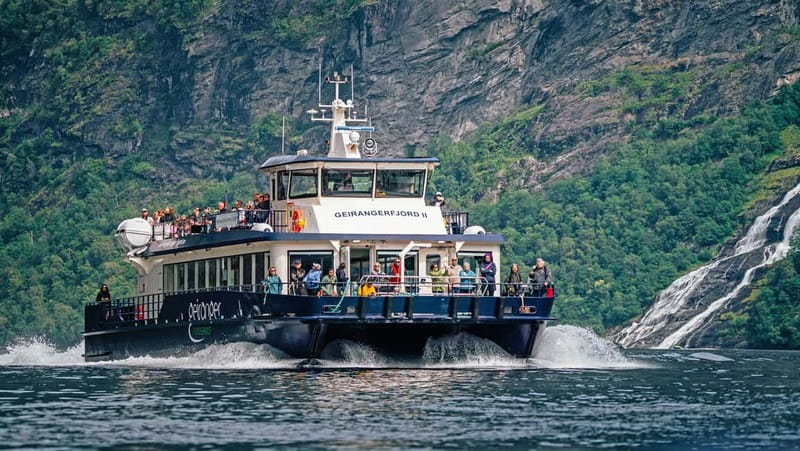 Geiranger: Fjord and Waterfalls Sightseeing Boat Trip - Watching the fjord walls rise around you