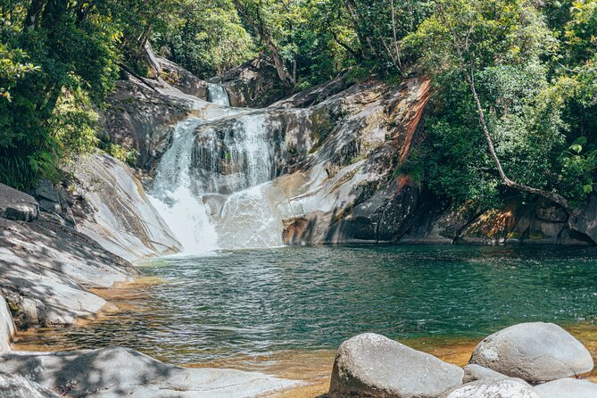 Private Waterfall and Rainforest Day Tour - Babinda Boulders combines water and stories