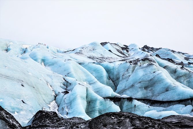 Reykjavik: South Coast, Waterfalls & Glacier Hike Small-Group - Seljalandsfoss and the slippery path behind the water