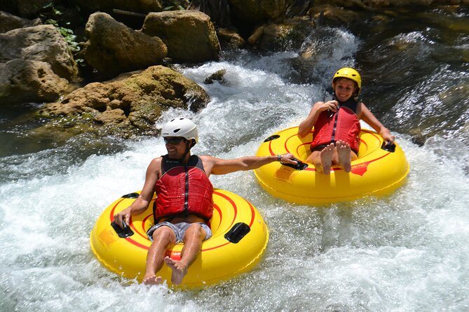 River Rapids Waterfalls Tubing and Beach Adventure with Transport - Tubing the Rio Bueno’s calm water and rapids