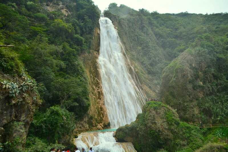 San Cristobal: Chiflon Waterfalls & Montebello Day Tour - Crossing a lake by wooden cayuco