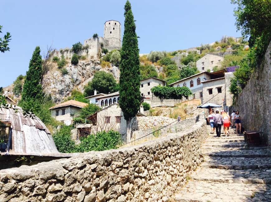 Sarajevo: Mostar, Konjic, Blagaj, Pocitelj, & Waterfall Tour - Počitelj climbs toward Ottoman-era views