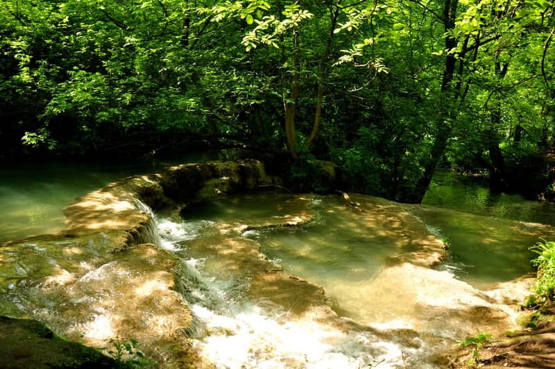 Sofia: Lovech, Devetaki Cave and Krushuna Waterfalls Tour - Lovech old town: cobbles, houses, and a fortress above the river