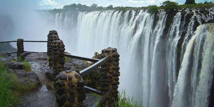 Sunrise Tour Of Victoria Falls-Scenic Water Falls Experience - Walking through the rainforest beside Mosi-oa-Tunya