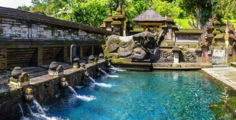 Ubud: Water Temple, Rice Terrace, and Waterfalls Tour - Kanto Lampo: water over stone