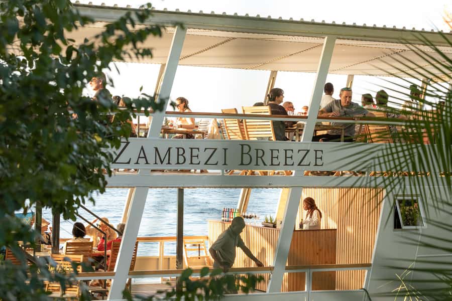 Victoria Falls: Dinner Cruise on the Zambezi River - Leaving Pure Africa Waterfront as the Zambezi turns gold
